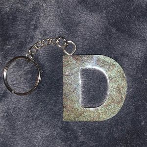 D Brown with green pearl resin key chain.